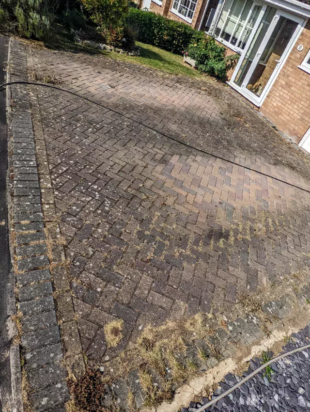 Block paving driveway cleaning before photo
