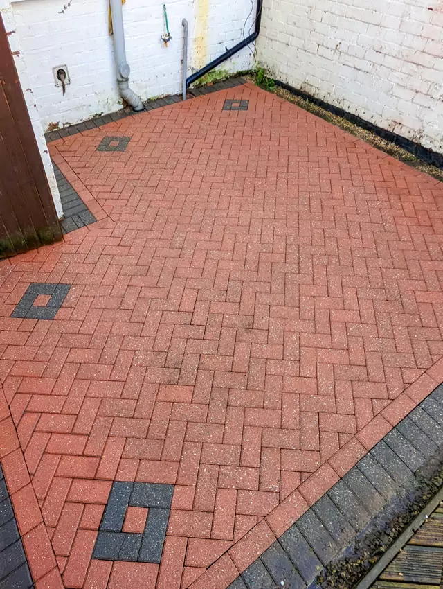 Pressure washing block paving patio after photo